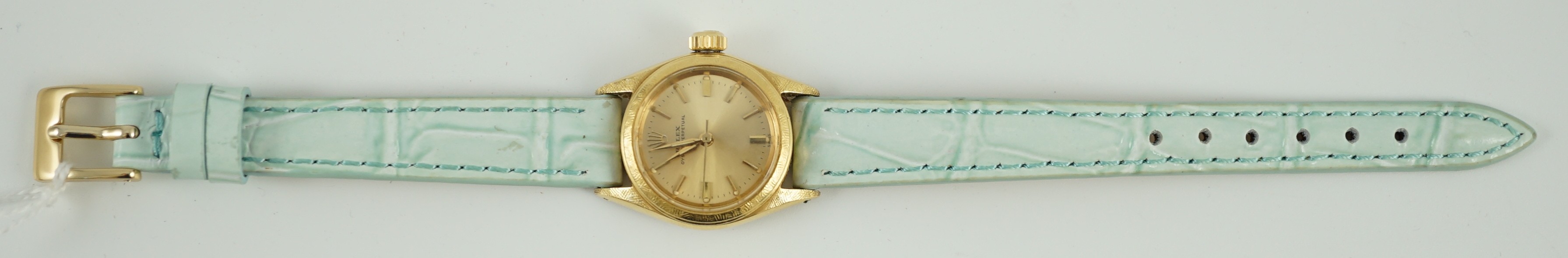 A lady's 18ct gold Rolex Oyster Perpetual wrist watch, on associated leather strap